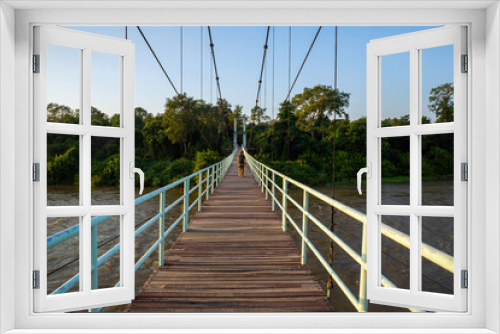 Fototapeta Naklejka Na Ścianę Okno 3D - Suspension bridge over the Mun River Ubon Ratchathani, Thailand.