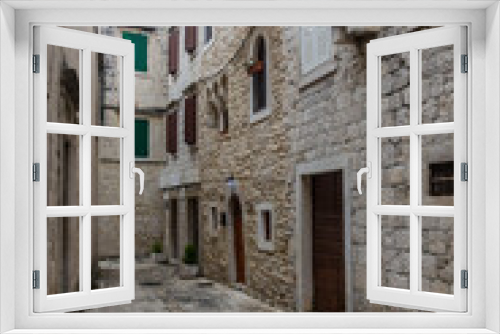 Fototapeta Naklejka Na Ścianę Okno 3D - Narrow alley in the old town of Trogir, Croatia