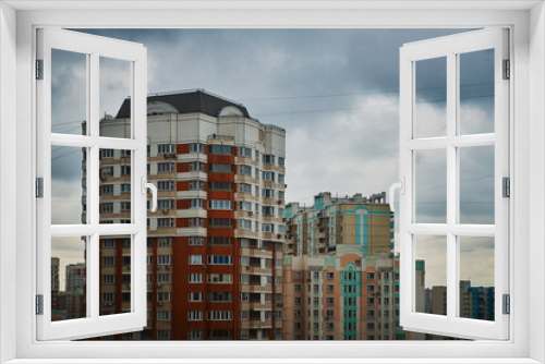 Fototapeta Naklejka Na Ścianę Okno 3D - Multi storey building. New modern residential building is ready for living. color house