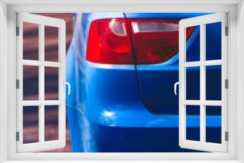 Fototapeta Naklejka Na Ścianę Okno 3D - Close up view of rear headlight of blue car. Back side, half.