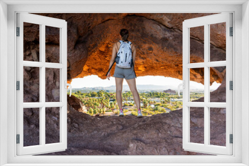Fototapeta Naklejka Na Ścianę Okno 3D - The view of Phoenix through the Hole-in-the-rock at Papago Park in Phoenix, Arizona