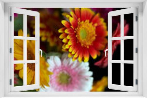 Fototapeta Naklejka Na Ścianę Okno 3D - Closeup beautiful bouquet of yellow red and pink flowers in glass vase isolated on black background. Valentine's day, 8 march or International women's day concept. Florist or botanical theme
