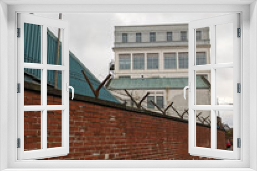 Fototapeta Naklejka Na Ścianę Okno 3D - Angled view of an old industrial building.