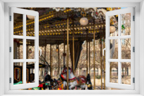 Fototapeta Naklejka Na Ścianę Okno 3D - Old French carousel in a Louvre park on a sunny winter day. Traditional fairground vintage carousel. Merry-go-round with horses. Paris, France.