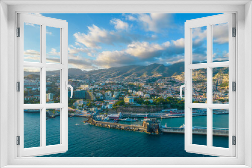 Aerial drone view of Funchal city center panorama in Madeira island in the evening. It's Portugal's Autonomous Region and is located in Atlantic ocean