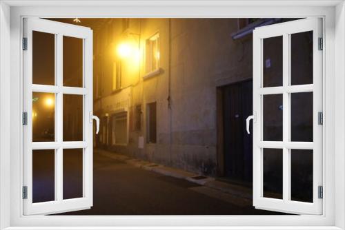 Fototapeta Naklejka Na Ścianę Okno 3D - Petite rue typique de village dans la brume la nuit, ville de Millery, département du Rhône, France