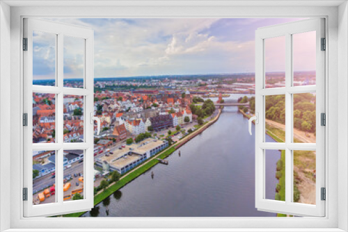 Fototapeta Naklejka Na Ścianę Okno 3D - Panoramic aerial view of Lubeck cityscape on a cloudy day, Germany.