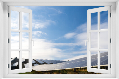 Fototapeta Naklejka Na Ścianę Okno 3D - Solar cell panels field. Rows of long sunny batteries on green field. Renewable alternative energy concept. Future technology concept