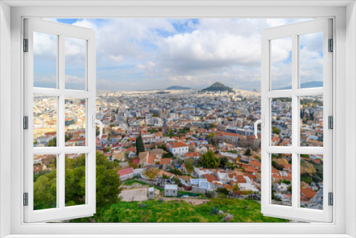 View of the Plaka and Monastiraki districts and Mount Lycabettus from the Acropolis on Acropolis Hill in Athens, Greece, on an overcast autumn day.