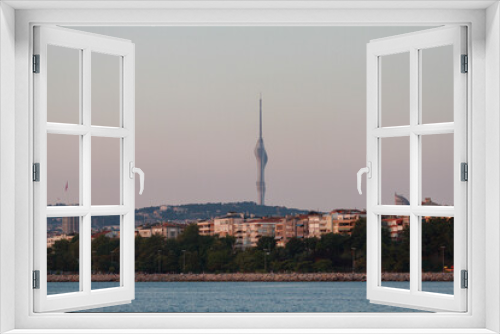 Fototapeta Naklejka Na Ścianę Okno 3D - View of the evening Istanbul and Camlica Hill from the Sea of ​​Marmara