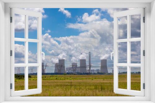 Fototapeta Naklejka Na Ścianę Okno 3D - Coal power station near Vereeniging in South Africa. 
Electrical pylons in the foreground. 
