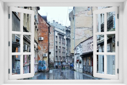 Fototapeta Naklejka Na Ścianę Okno 3D -  Street of the old town on a damp gray winter day 