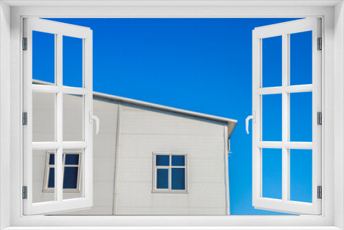 Fototapeta Naklejka Na Ścianę Okno 3D - White warehouse blue sky on background
