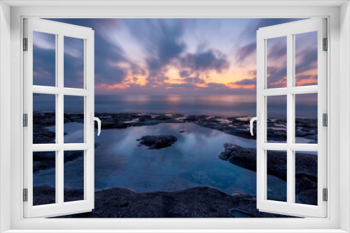 Fototapeta Naklejka Na Ścianę Okno 3D - Twilight scenic sea landscape with beautiful shore, blurred flying dramatic blue clouds, amazing shoreline and sunset on background