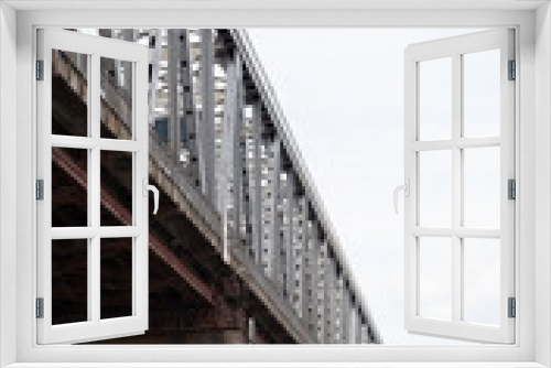 Fototapeta Naklejka Na Ścianę Okno 3D - Metal bridge over wide river