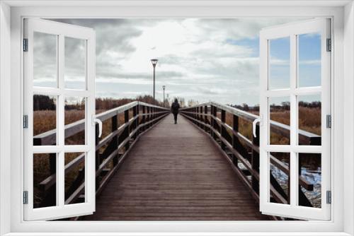 Fototapeta Naklejka Na Ścianę Okno 3D - The longest wooden pedestrian bridge across Sirvena lake in Birzai, Lithuania