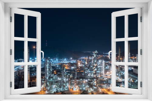 Fototapeta Naklejka Na Ścianę Okno 3D - Chemical industry storage tank and oil refinery in Industrial Plant at night over lighting, Fuel and power generation, petrochemical factory industry zone