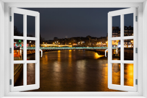 Night Paris, Akrol bridge, reflection of lights in the river Seine, cityscape