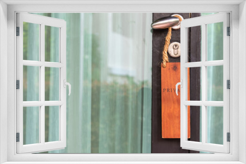 Fototapeta Naklejka Na Ścianę Okno 3D - Closed glass door with wooden sign PRIVACY on handle at hotel.
