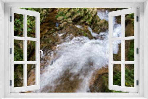 Fototapeta Naklejka Na Ścianę Okno 3D - Waterfall in a lush rainforest.