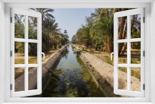 Fototapeta Naklejka Na Ścianę Okno 3D - Irrigation canal by the river Nile, Egypt