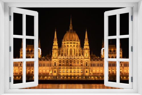 Hungarian parliament building from across the Danube river at night Budapest Hungary Europe