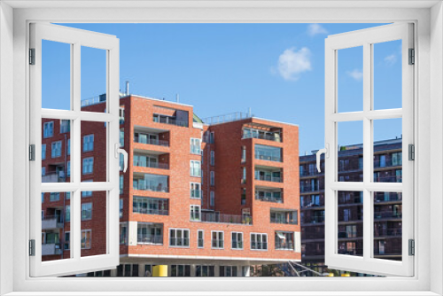 Fototapeta Naklejka Na Ścianę Okno 3D - Facades of modern buildings in the city of Hamburg Germany. Hamburg city on a sunny day. Residential area in the city. modern architecture. Multi-story houses. Office building. Rent an apartment