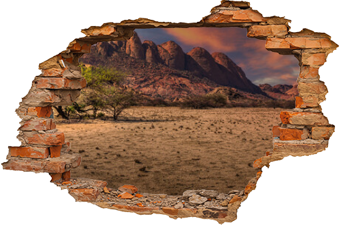 A panorama view of the colorful sunset over the safari in Spitzkoppe, Namibia