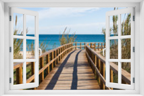 Fototapeta Naklejka Na Ścianę Okno 3D - A footbridge leading to a Mediterranean resort beach