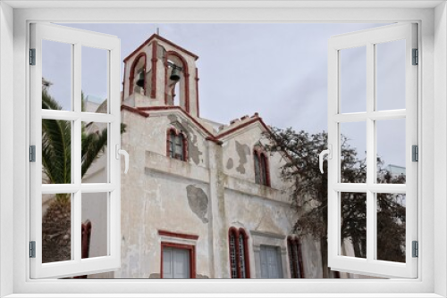 Fototapeta Naklejka Na Ścianę Okno 3D - View of a beautiful old Greek orthodox church in Fira Santorini Greece 