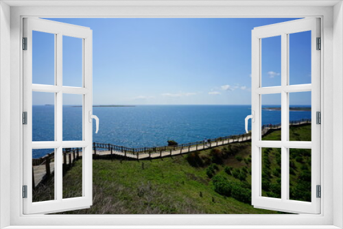 Fototapeta Naklejka Na Ścianę Okno 3D - seaside cliff walkway and distant island