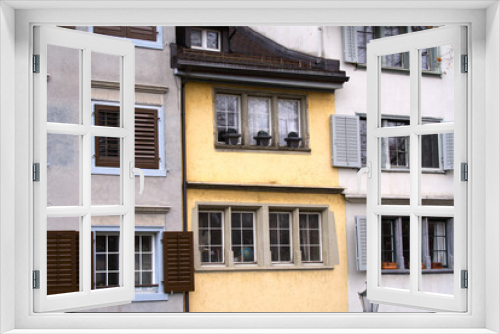 Fototapeta Naklejka Na Ścianę Okno 3D - Close-up of beautiful colorful facades of historic houses at medieval old town of Zürich on a winter day. Photo taken February 1st, 2022, Zurich, Switzerland.