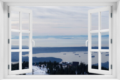 Fototapeta Naklejka Na Ścianę Okno 3D - Panoramic View of Top of Grouse Mountain Ski Resort with the City in the background. North Vancouver, British Columbia, Canada.