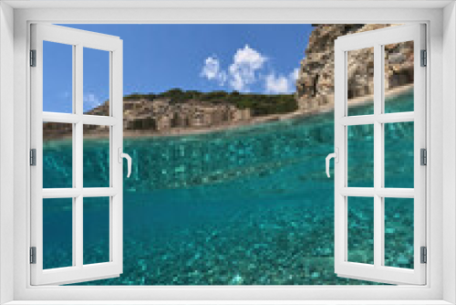 Fototapeta Naklejka Na Ścianę Okno 3D - Underwater split photo of beautiful paradise pebble rocky bay of Kaladi with turquoise crystal clear sea and small caves, Kythira island, Ionian, Greece