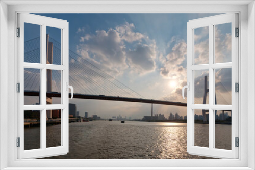 Fototapeta Naklejka Na Ścianę Okno 3D - Landscape of Shanghai Nanpu bridge and city skyline viewed from sailing ship in sunny day.