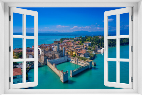 Fototapeta Naklejka Na Ścianę Okno 3D - Italian castle on Lake Garda. Sirmione aerial view. Top view, historic center of the Sirmione peninsula, lake garda. Aerial panorama of Sirmione. Lake Garda, Sirmione, Italy.
