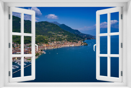 Fototapeta Naklejka Na Ścianę Okno 3D - Aerial view of the town on Lake Garda. Panoramic view of the historic part of Salò on Lake Garda Italy. Tourist site on Lake Garda. Lake in the mountains of Italy.