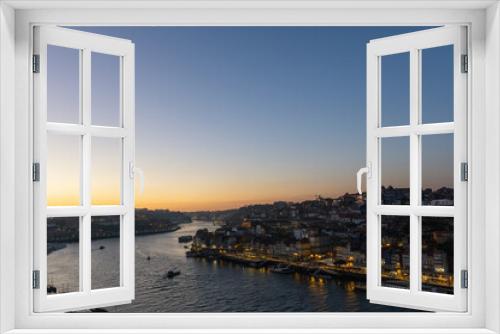 Fototapeta Naklejka Na Ścianę Okno 3D - Sunset on the Douro river and the city of Porto illuminated.