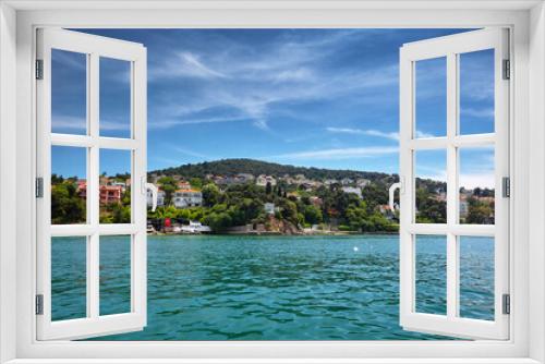 Fototapeta Naklejka Na Ścianę Okno 3D - View of the sea and the coast of the island with residential buildings. Travel to Buyukada, Adalar, Prince Islands, Istanbul, Turkey
