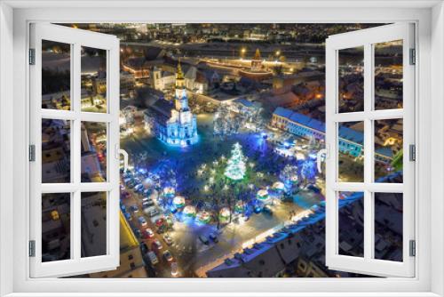 Fototapeta Naklejka Na Ścianę Okno 3D - Aerial panoramic drone photo of Kaunas Old Town with a Christmas market and a Christmas tree with decorations at night