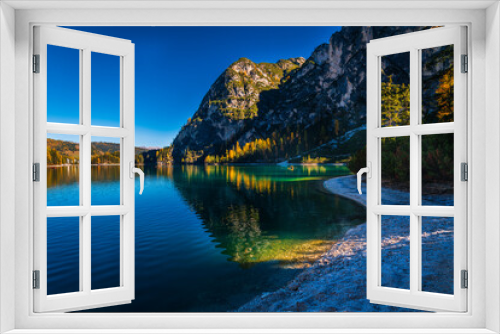 Fototapeta Naklejka Na Ścianę Okno 3D - Autumn and golden reflections on Lake Braies. Park of the Dolomites.