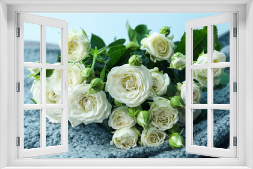 Fototapeta Naklejka Na Ścianę Okno 3D - Bouquet of beautiful fresh roses on plaid against blue background