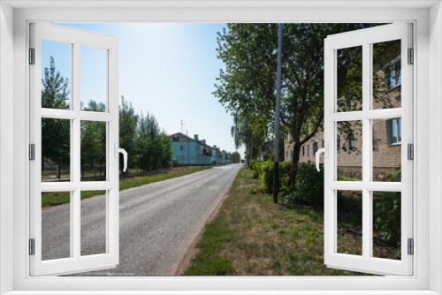 Fototapeta Naklejka Na Ścianę Okno 3D - City street in summer. Trees on the street.