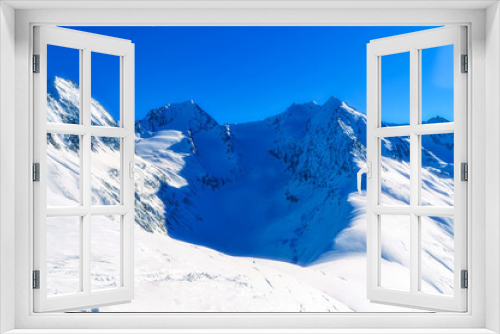 Fototapeta Naklejka Na Ścianę Okno 3D - Panoramically view over Austrian Alps covered with snow on altitude higher than 2000 meters above the sea during sunny winter day.