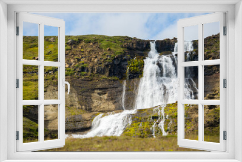 Fototapeta Naklejka Na Ścianę Okno 3D - Rjukandi waterfalls in sunshine also called Yst i-Rjukandi with cliffs and waterfalls in Eastern Iceland near Egilsstadi