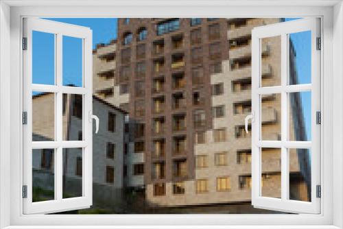 Fototapeta Naklejka Na Ścianę Okno 3D - Beautiful apartment building lined with traditional stone in Yerevan. Armenia 