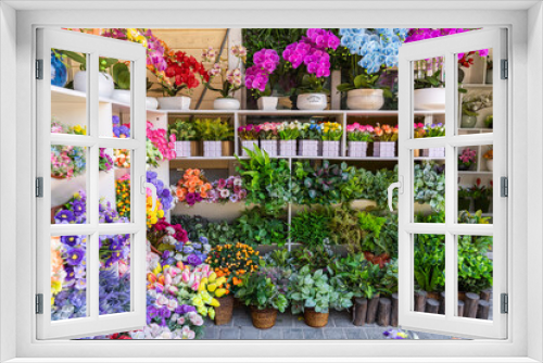 Fototapeta Naklejka Na Ścianę Okno 3D - Beautiful multicolored artificial flowers background. flowers decor