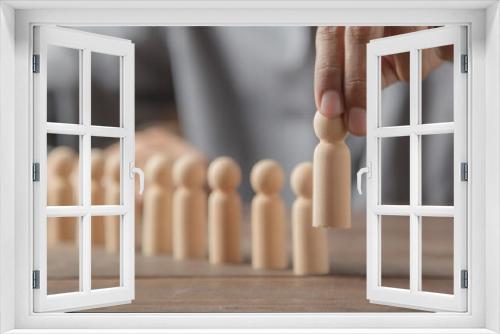 Fototapeta Naklejka Na Ścianę Okno 3D - Hand choose person wooden doll concept of leadership and business team creative thinking and human resources for teamwork or team player.