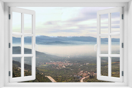 Fototapeta Naklejka Na Ścianę Okno 3D - Panoramic view of snowy and foggy Odemis