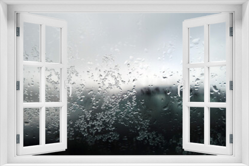 Fototapeta Naklejka Na Ścianę Okno 3D - Snow and rain drops on car window. Blur defocused abstract